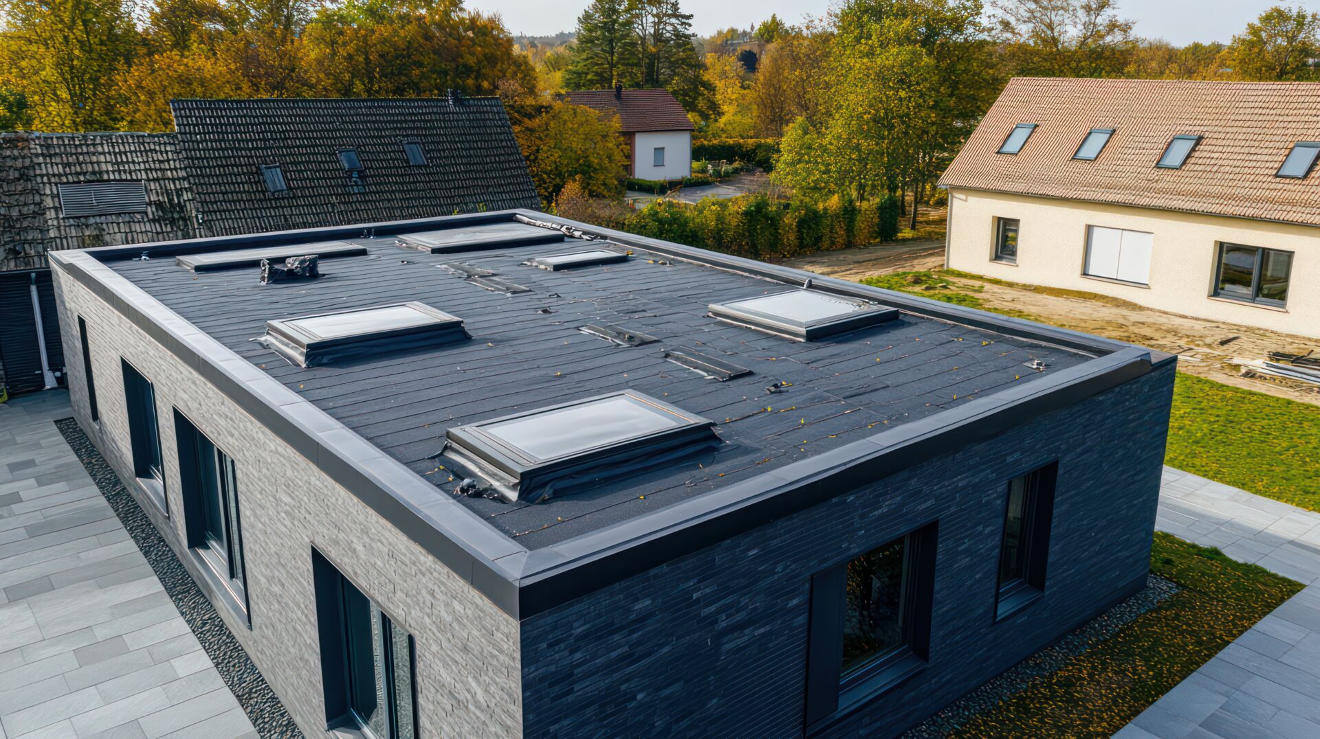 Flat roofing drainage solutions, featuring a flat rooftop with innovative drainage systems to prevent water buildup