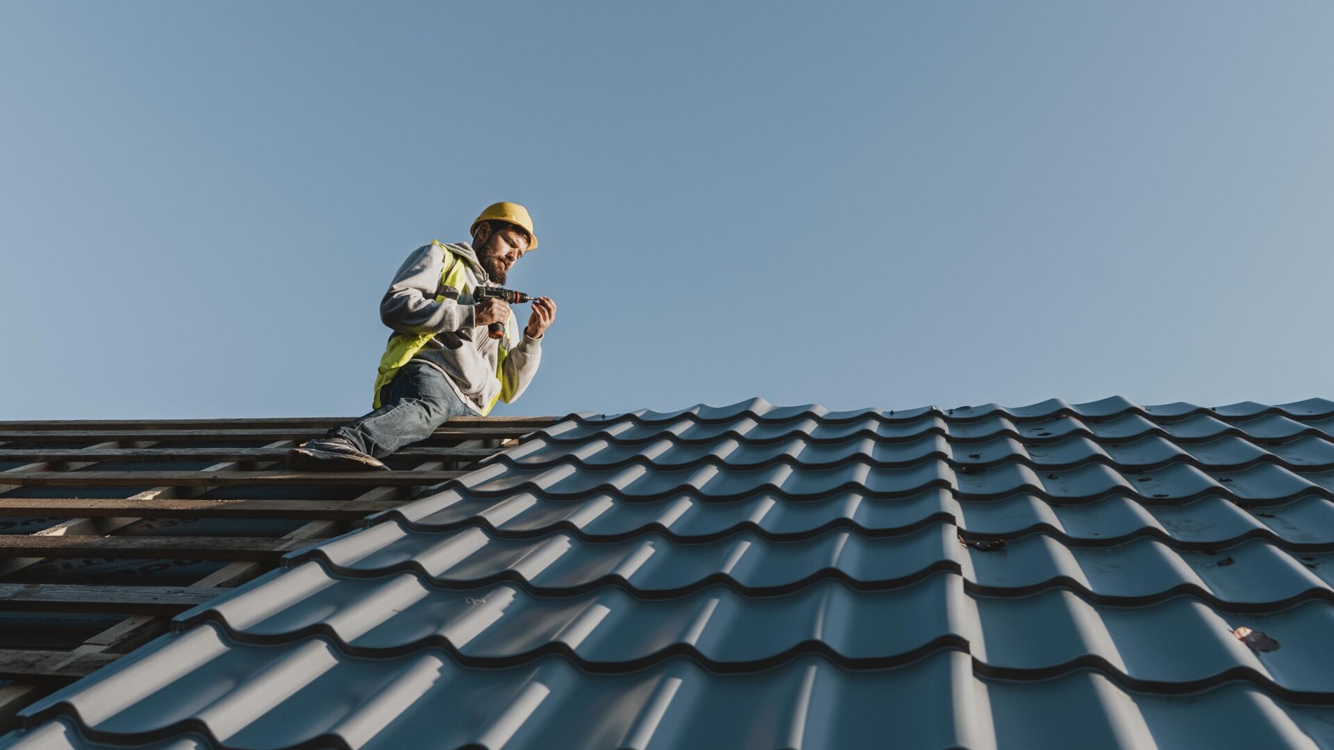 New roof installations ceramic tiles being installed