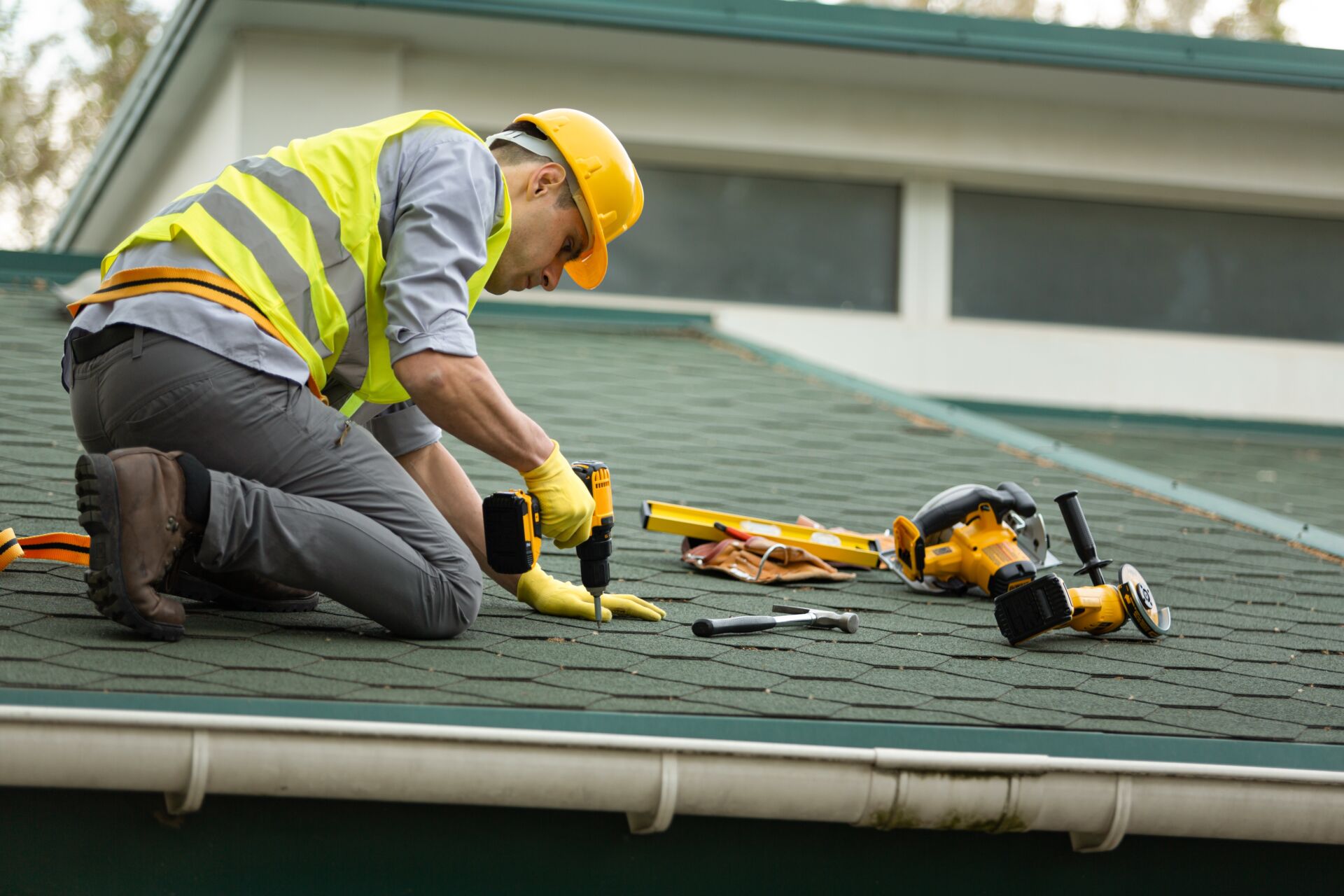 Repairing roof with new felt on a pitched roof surface