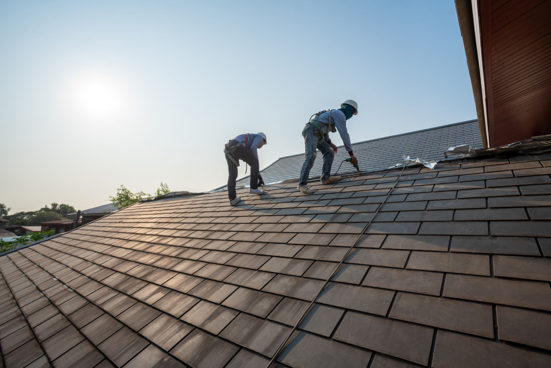 Roof repair work with pneumatic nail gun